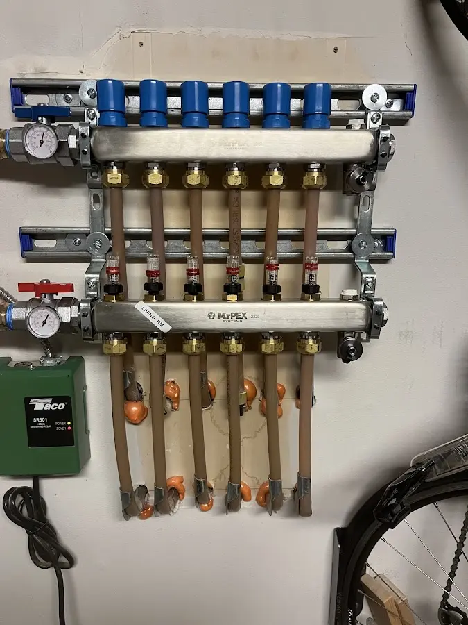 Plumber performing Gas Leak Detection at a residential property in Monroe